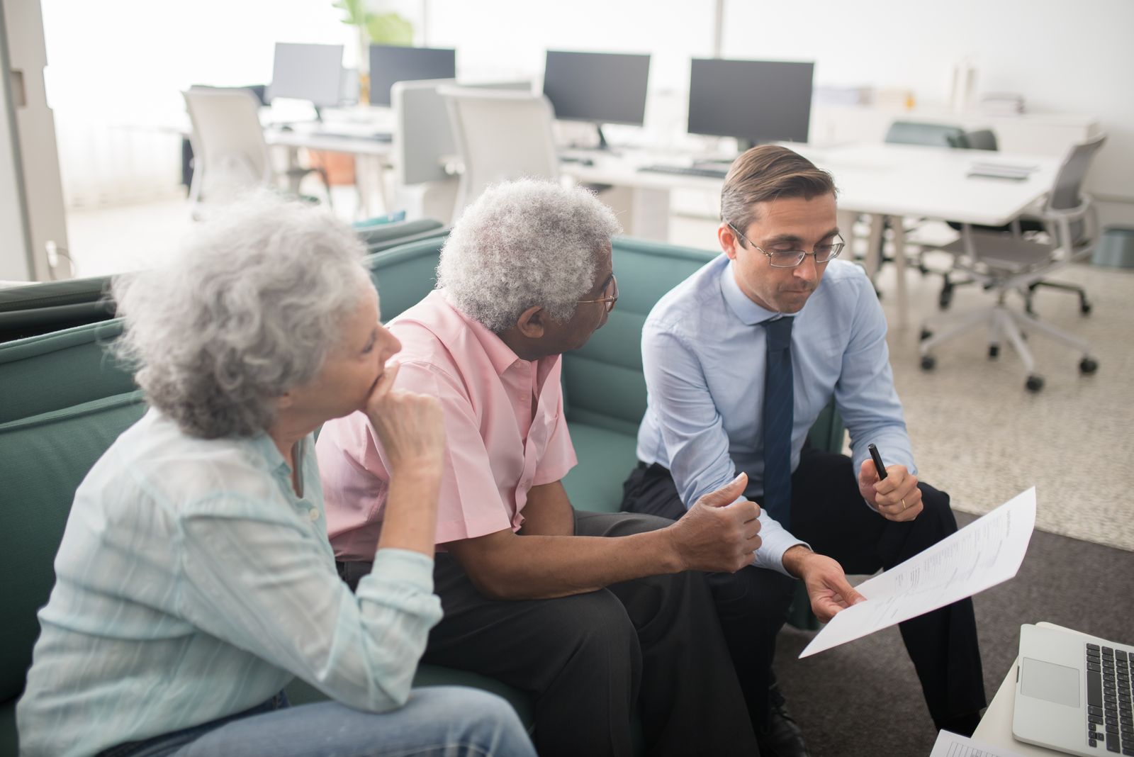 A financial adviser discussing plans with clients